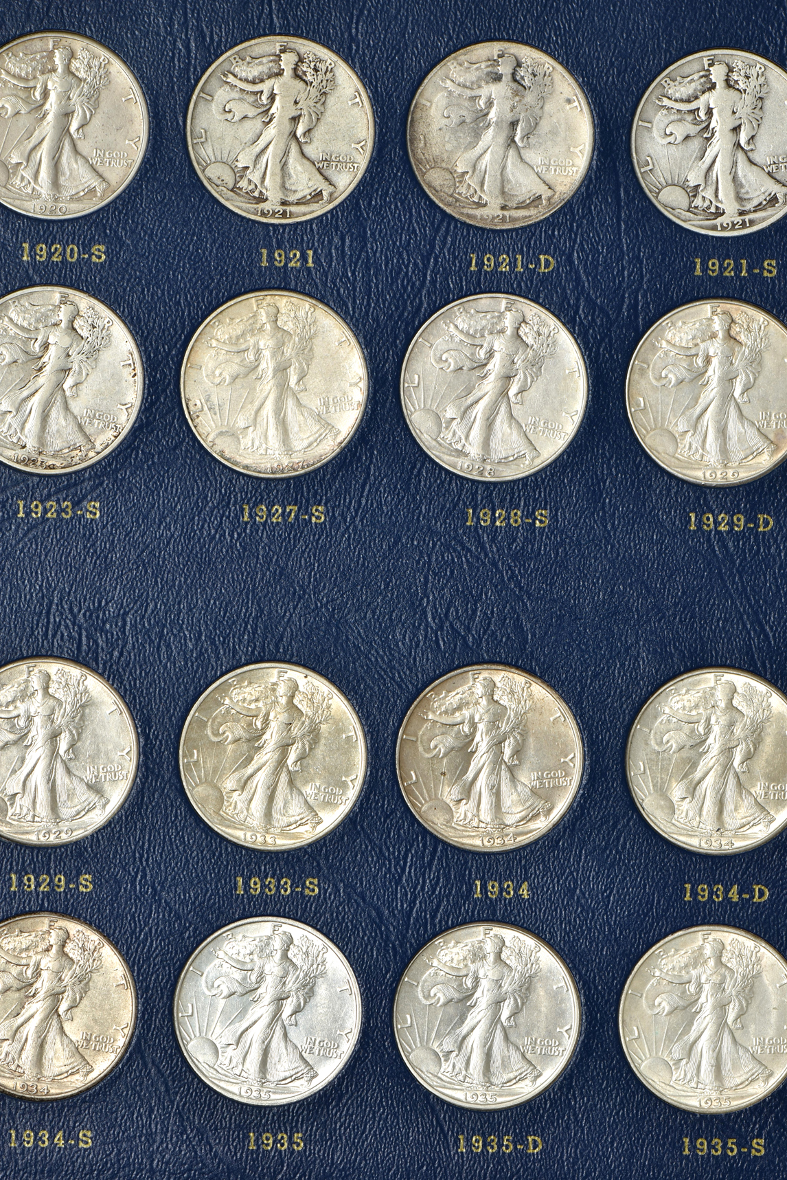 Complete collection of Walking Liberty half-dollars in two Whitman albums