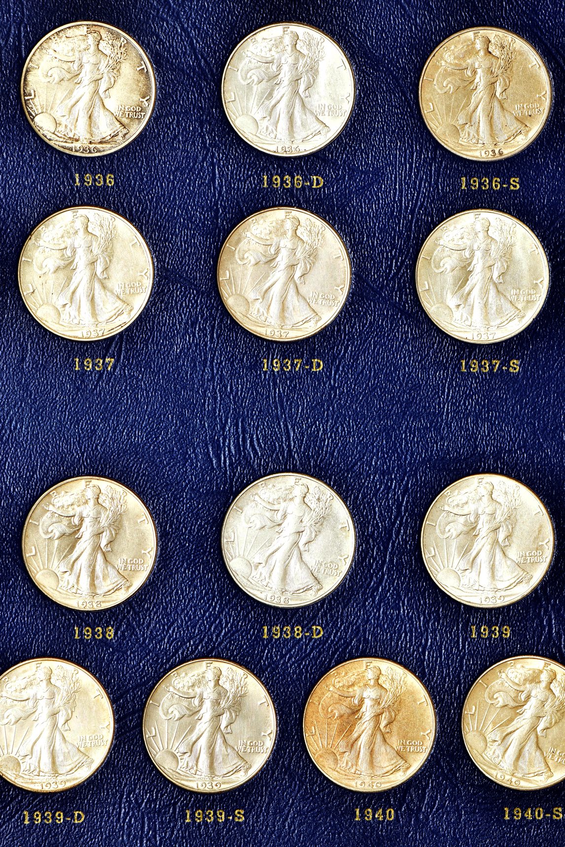 Complete collection of Walking Liberty half-dollars in two Whitman albums