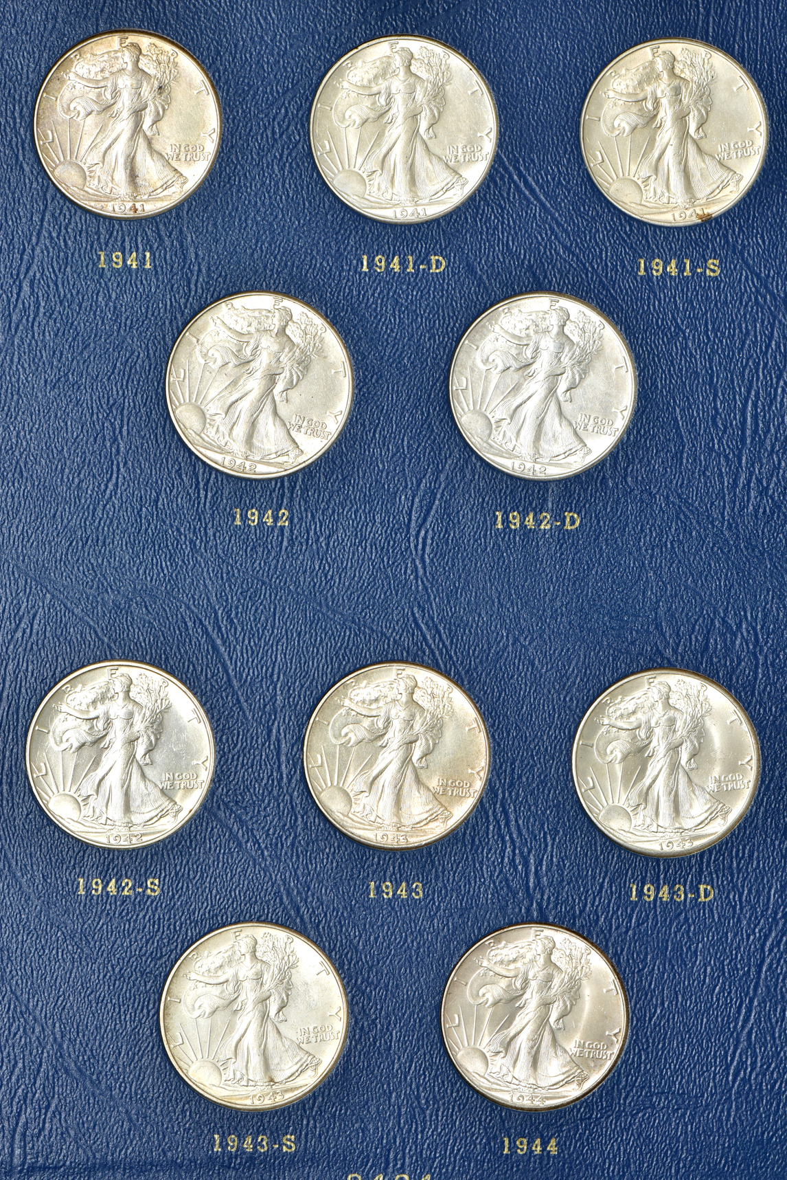 Complete collection of Walking Liberty half-dollars in two Whitman albums