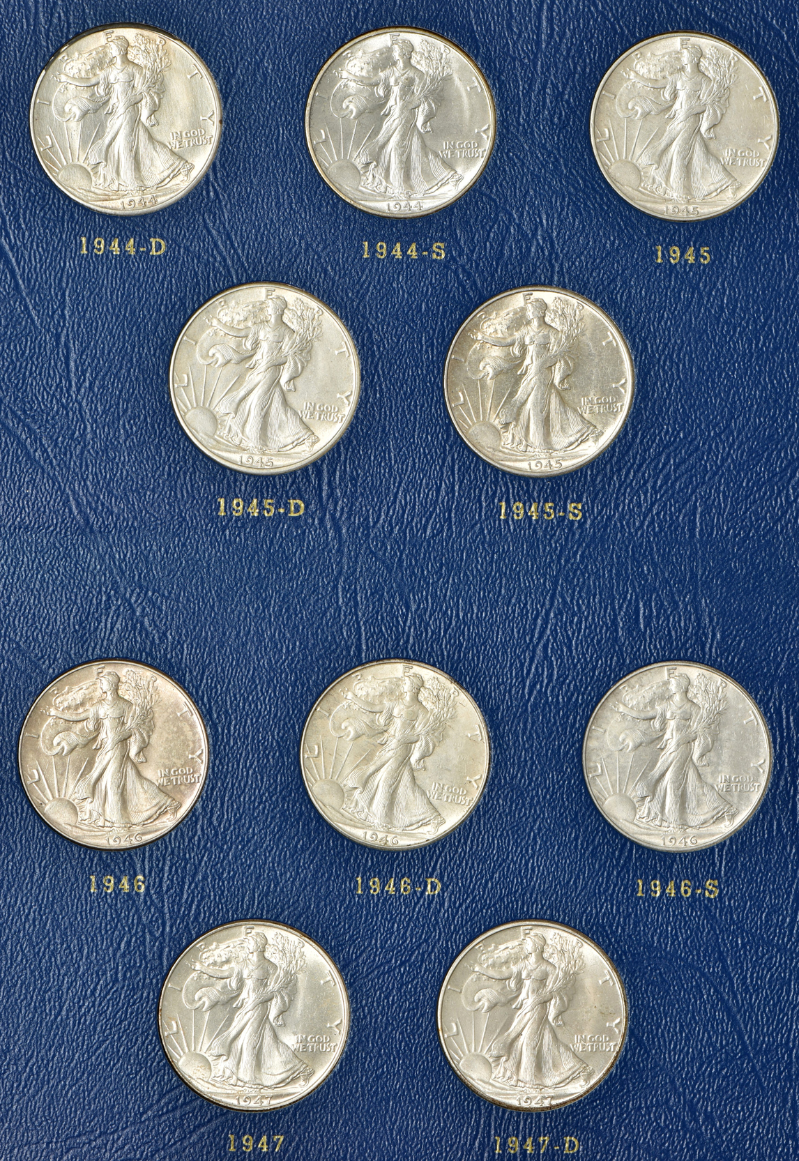 Complete collection of Walking Liberty half-dollars in two Whitman albums