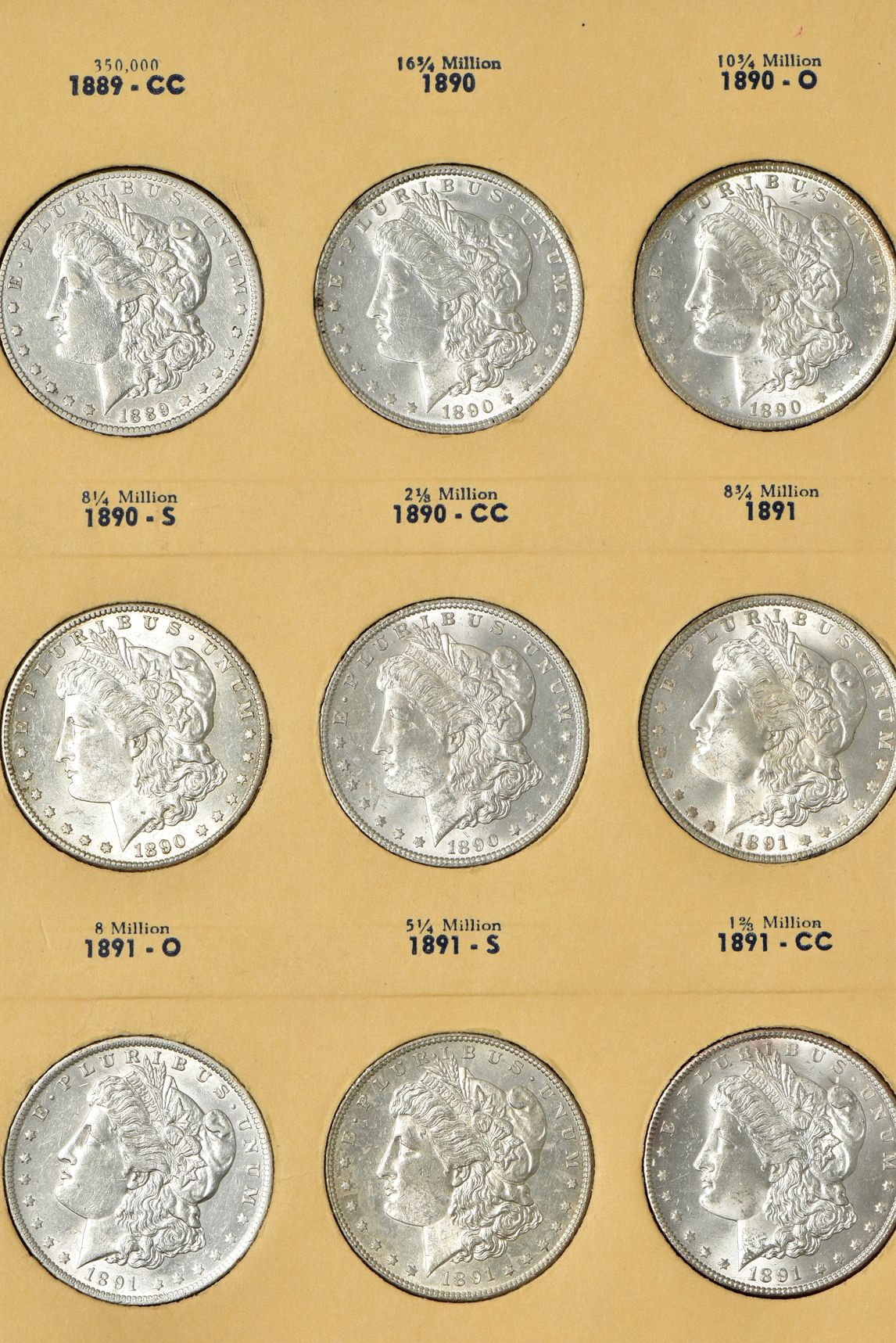 Collection of 34 different Morgan silver dollars in a Library of Coins Vol. 24 album