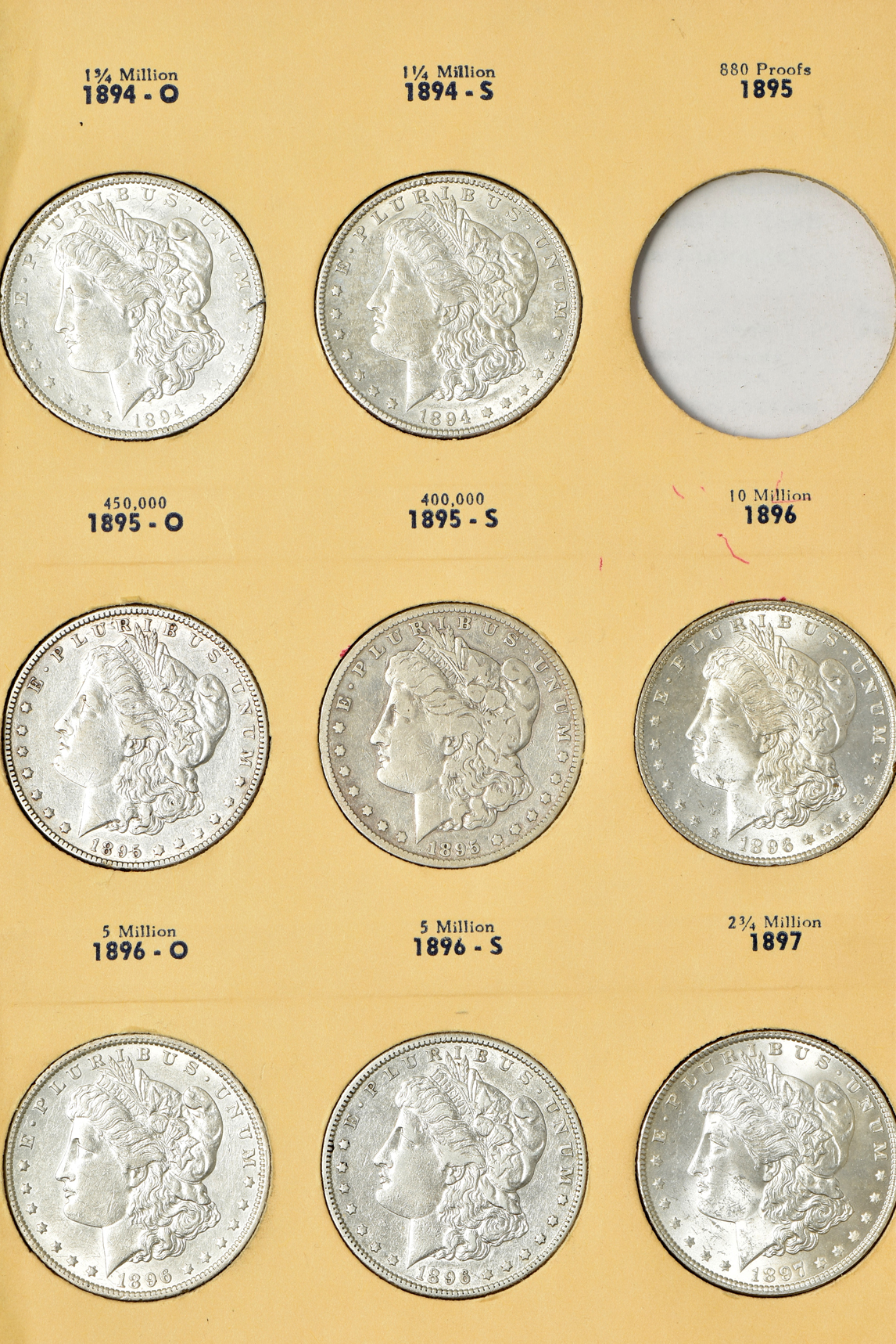 Collection of 34 different Morgan silver dollars in a Library of Coins Vol. 24 album