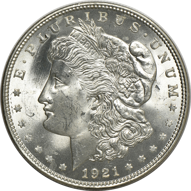 Four Morgan silver dollars, a Peace silver dollar, and a Walking Liberty half-dollar