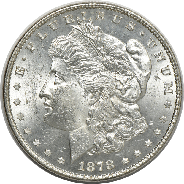 Four Morgan silver dollars, a Peace silver dollar, and a Walking Liberty half-dollar