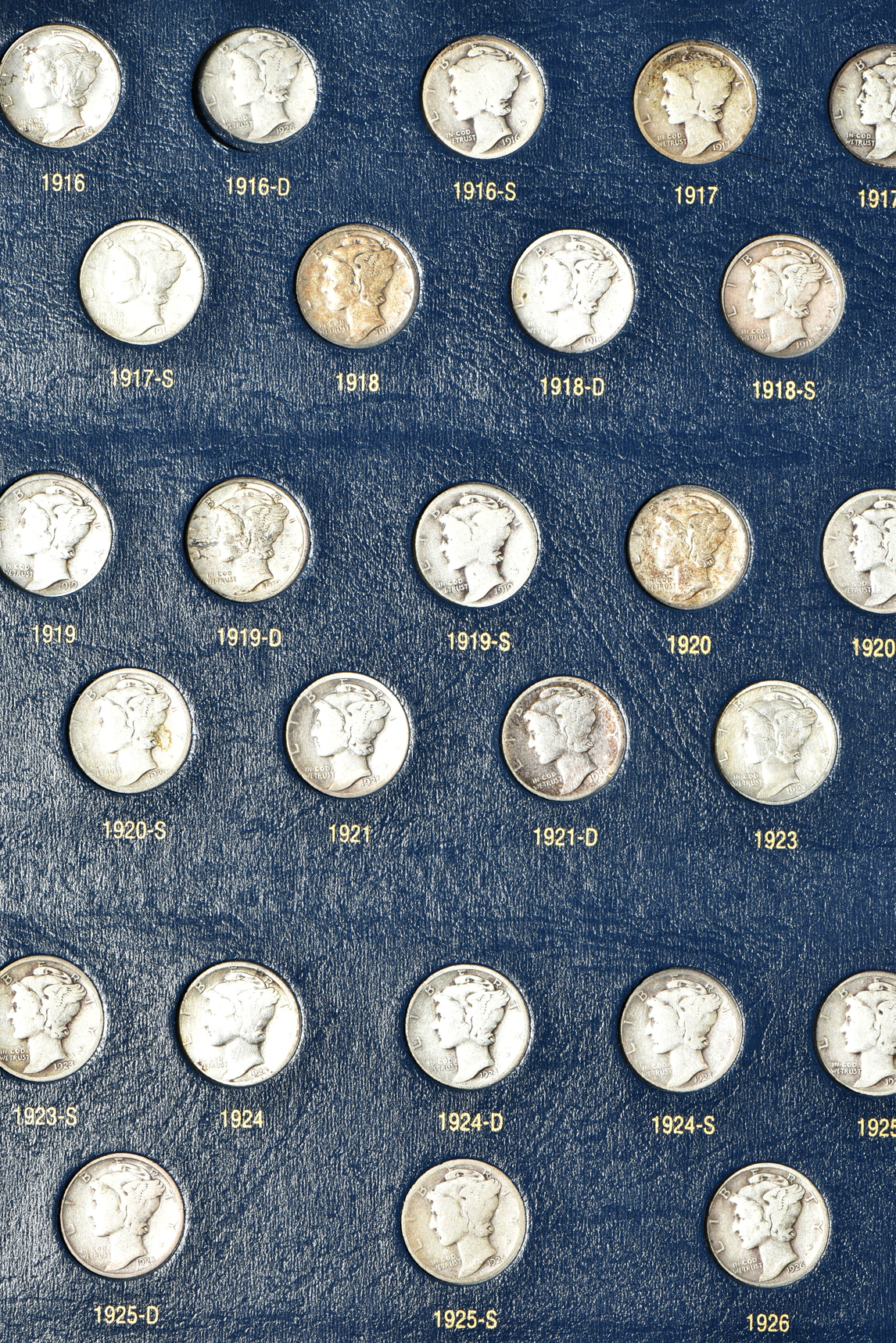 Collections of Mercury dimes and Roosevelt dimes in Whitman Classic albums