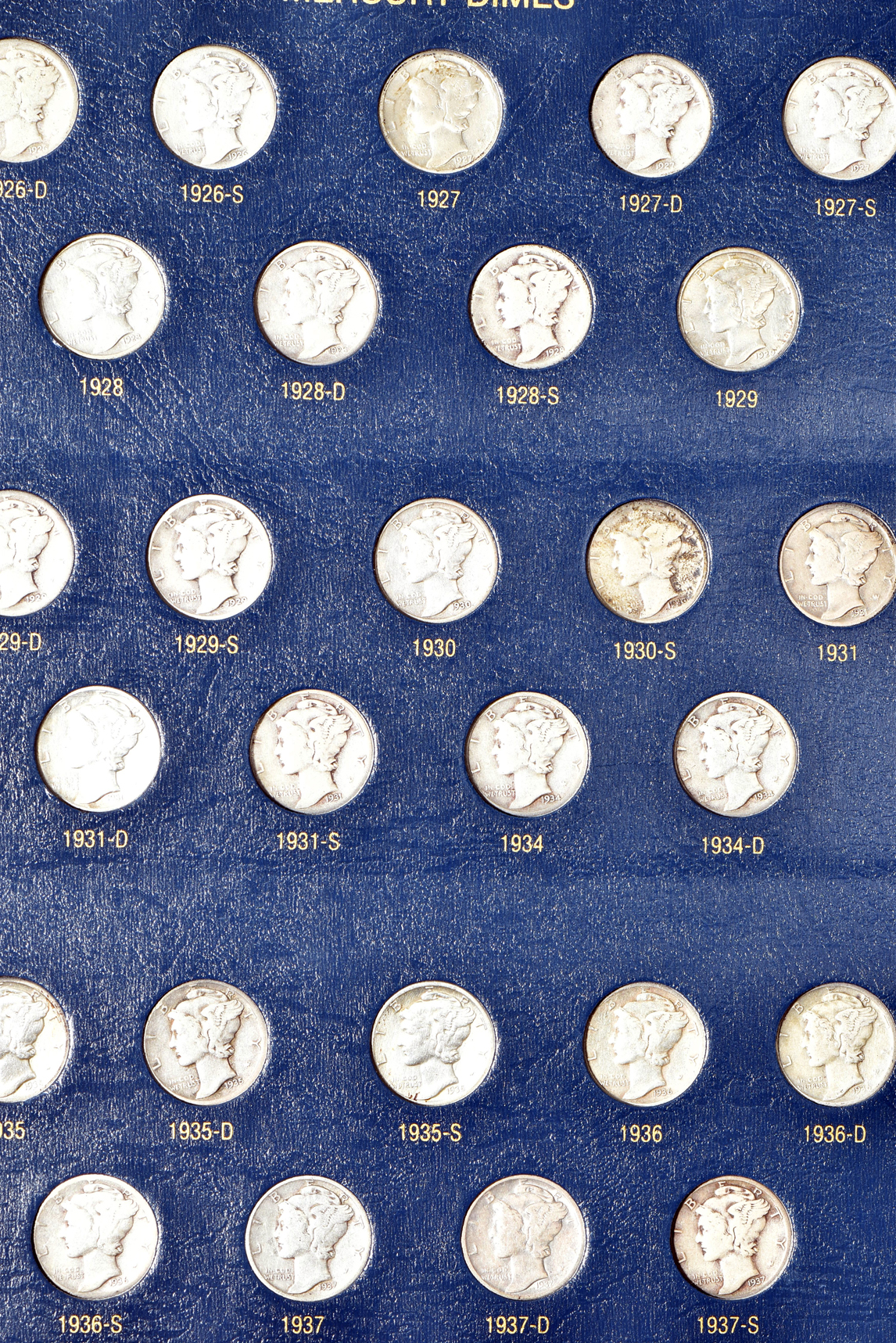 Collections of Mercury dimes and Roosevelt dimes in Whitman Classic albums