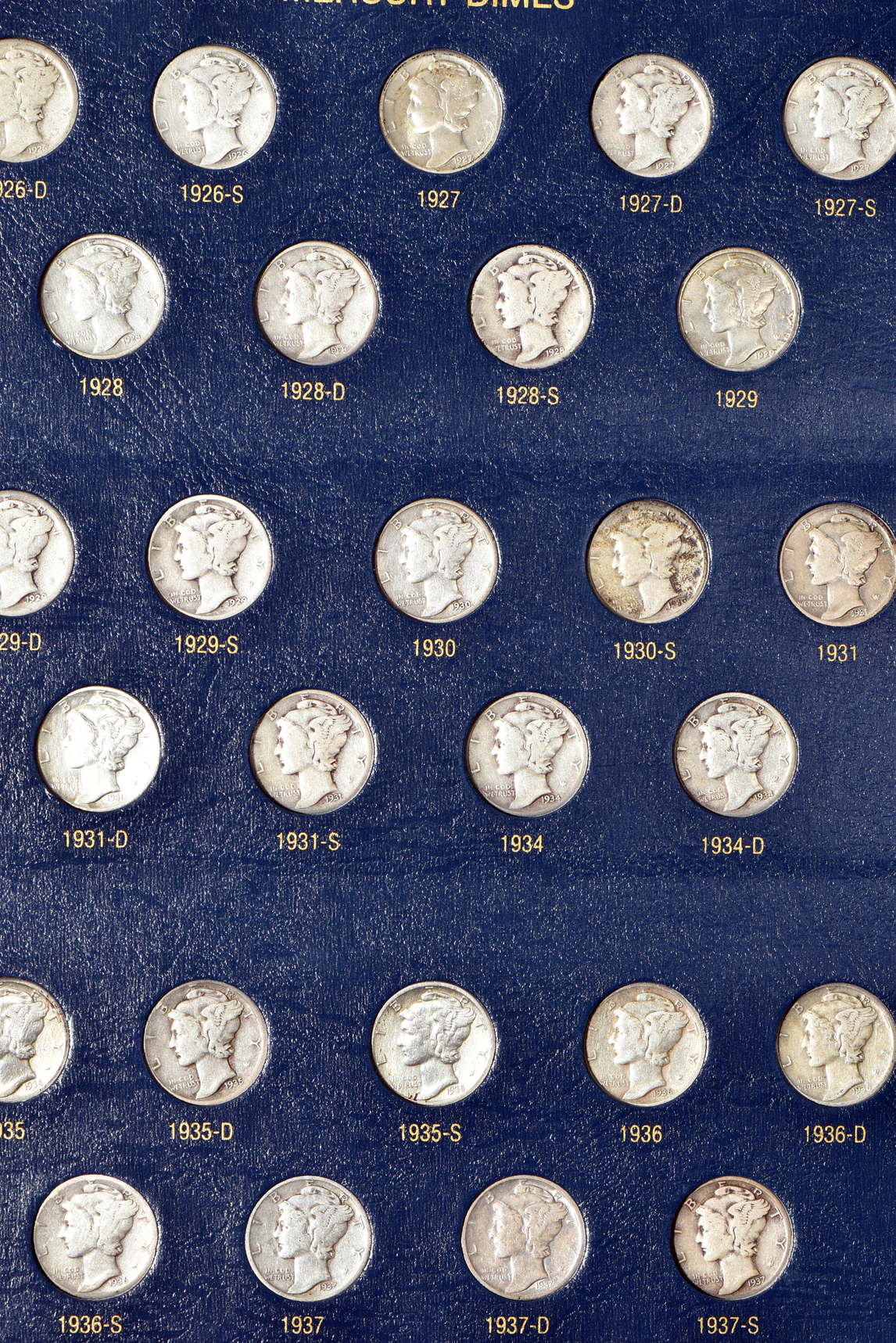 Collections of Mercury dimes and Roosevelt dimes in Whitman Classic albums