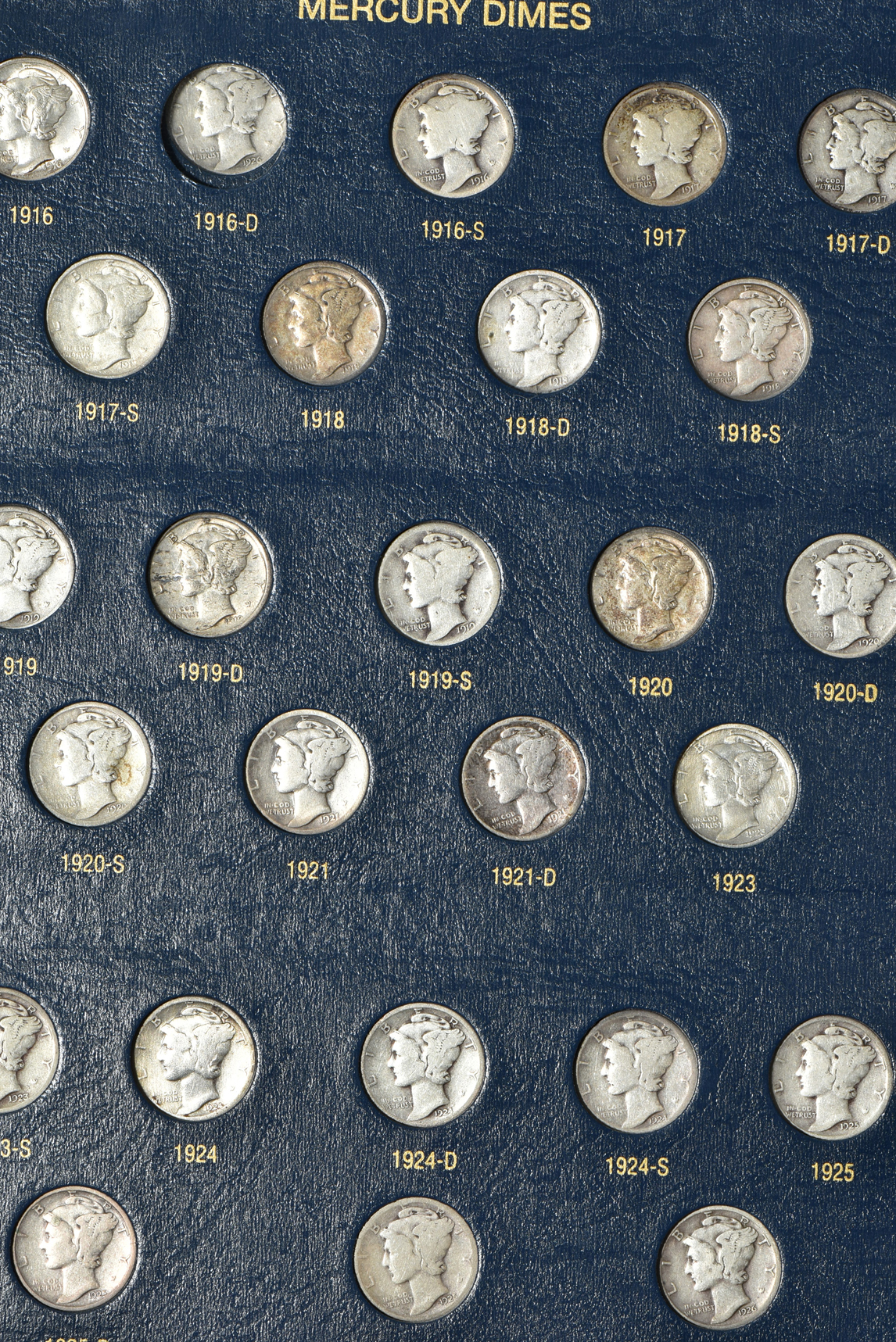 Collections of Mercury dimes and Roosevelt dimes in Whitman Classic albums