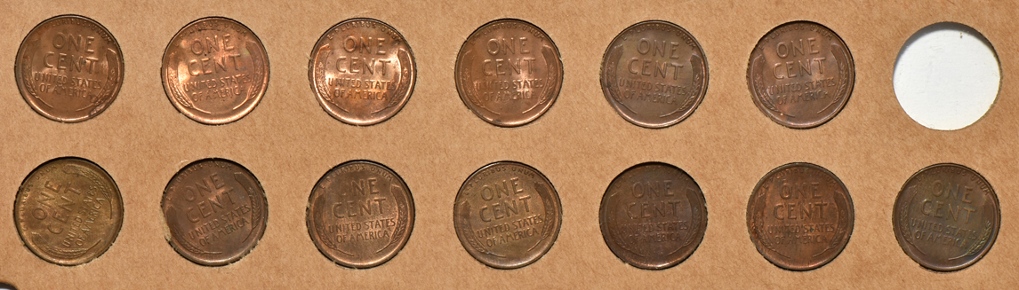 Thirteen Lincoln cents in a Wayte Raymond album