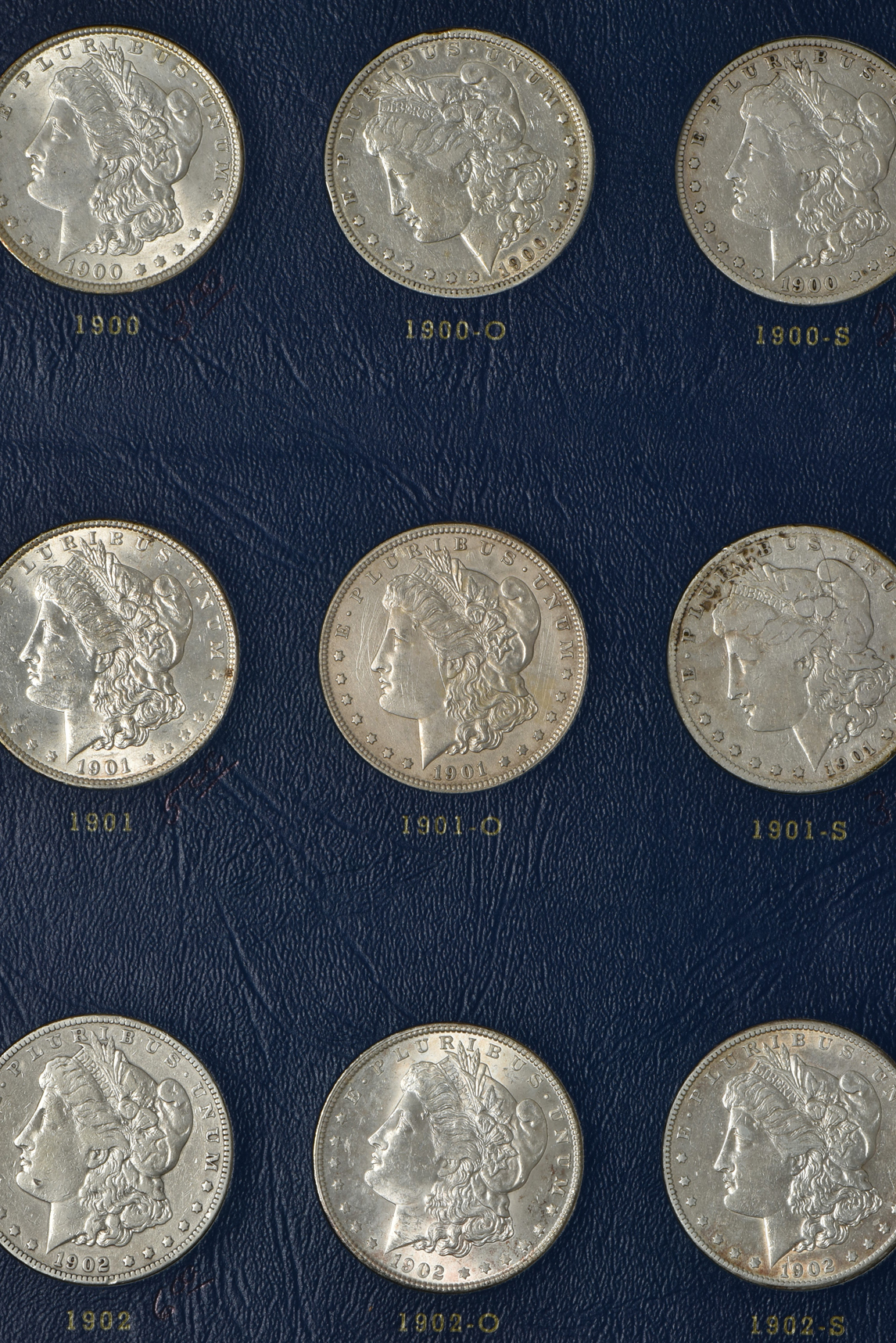 Collection of 27 different Morgan silver dollars, 1897 through 1921-S, in a complete Whitman 9429 album