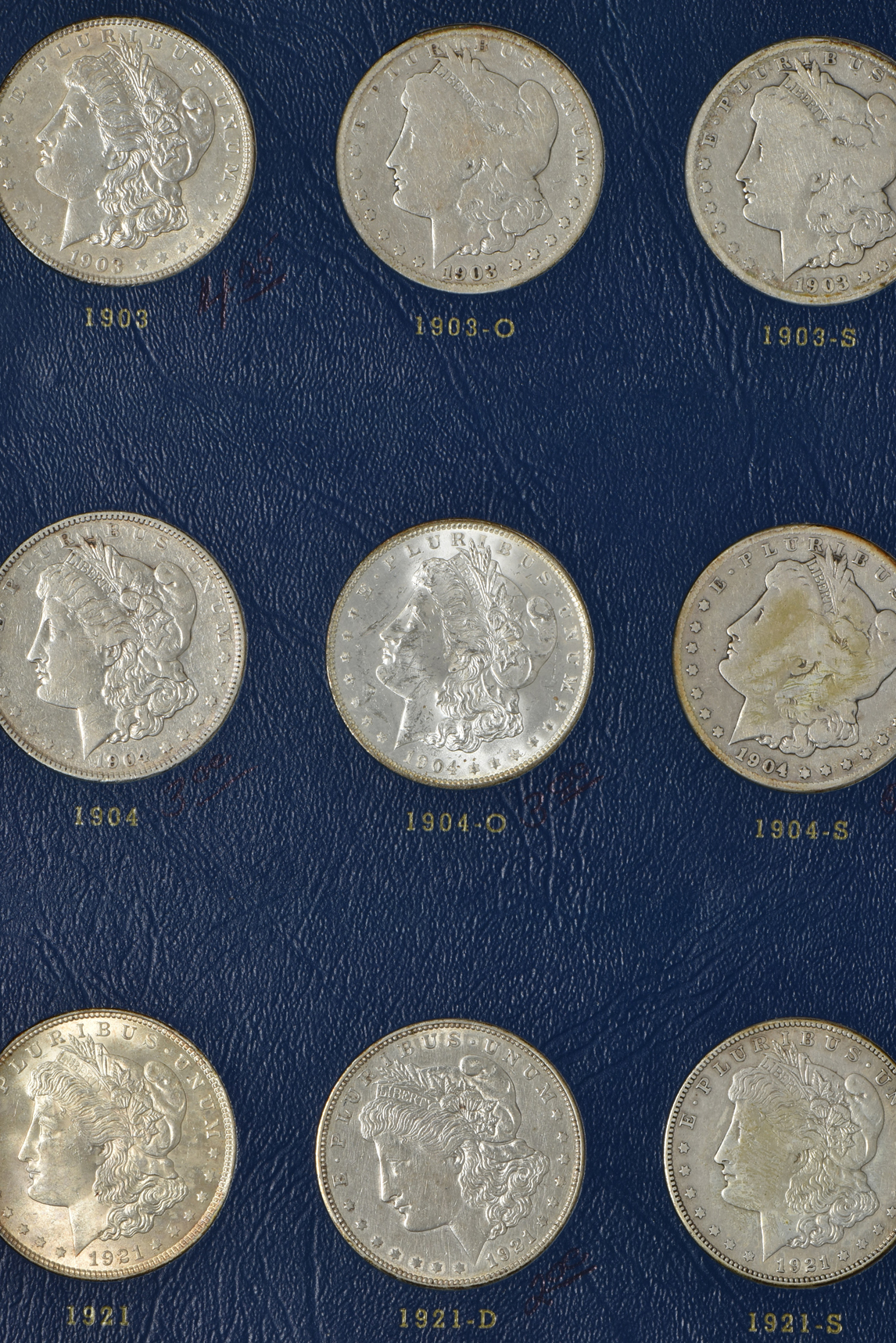 Collection of 27 different Morgan silver dollars, 1897 through 1921-S, in a complete Whitman 9429 album