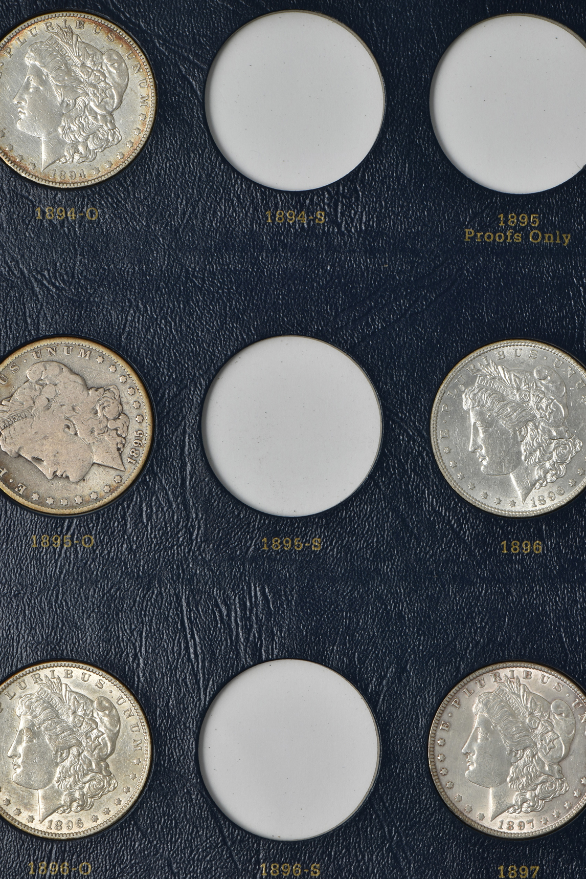 Collection of 33 different Morgan silver dollars in a Whitman 9129 album