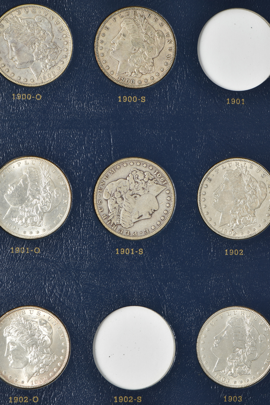 Collection of 33 different Morgan silver dollars in a Whitman 9129 album