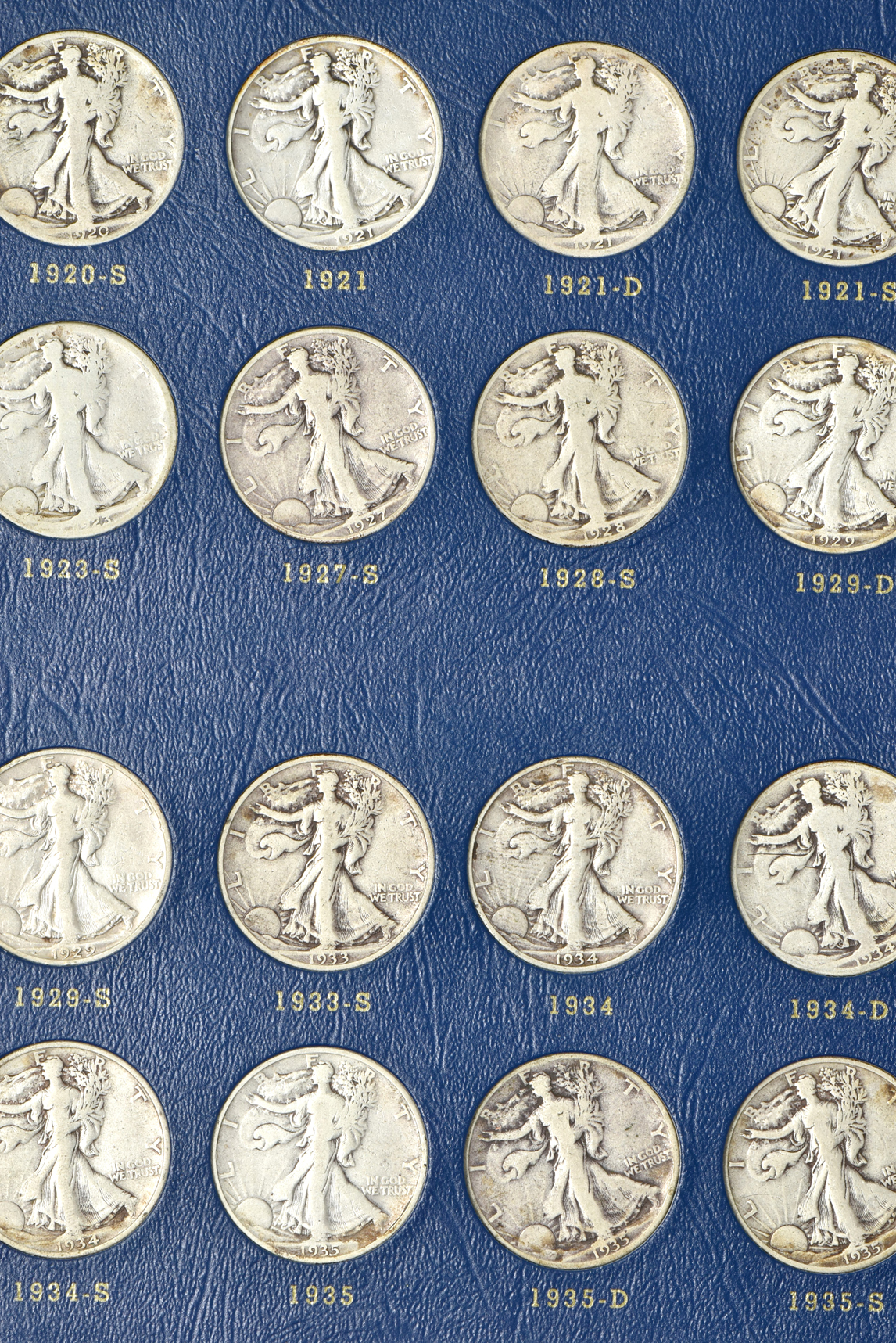 Complete collection of Walking Liberty half-dollars in two Whitman albums