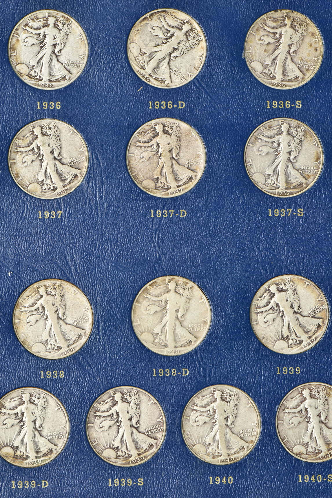 Complete collection of Walking Liberty half-dollars in two Whitman albums