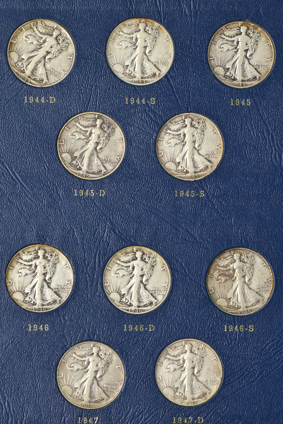 Complete collection of Walking Liberty half-dollars in two Whitman albums
