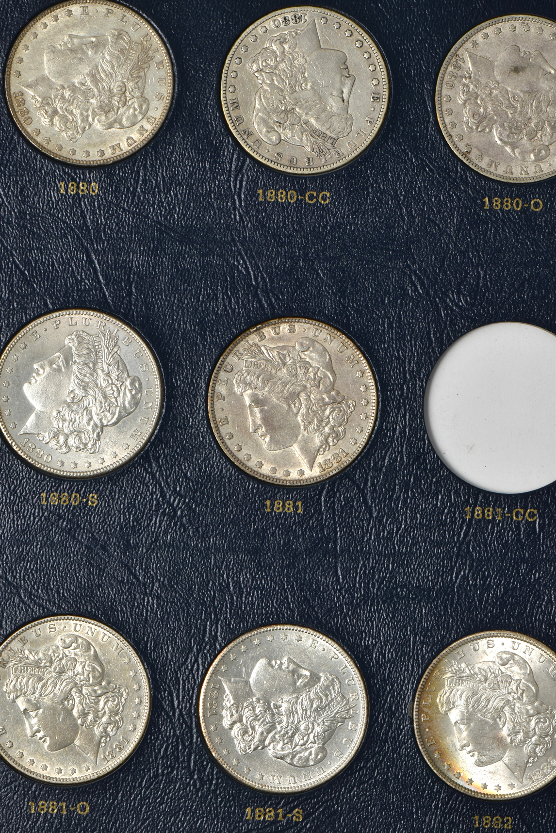 Collection of 46 different Morgan silver dollars in a Whitman 9128 album