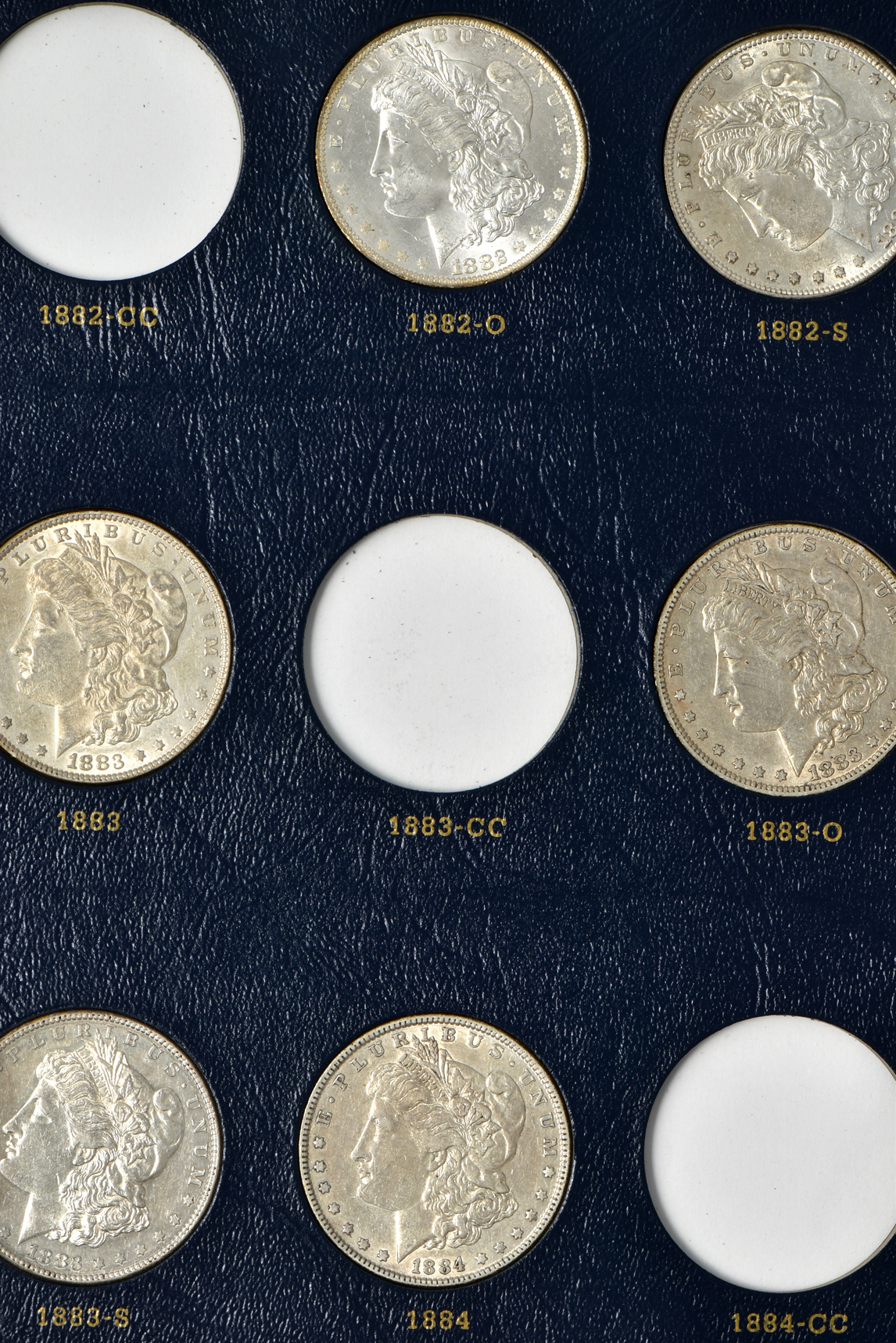 Collection of 46 different Morgan silver dollars in a Whitman 9128 album