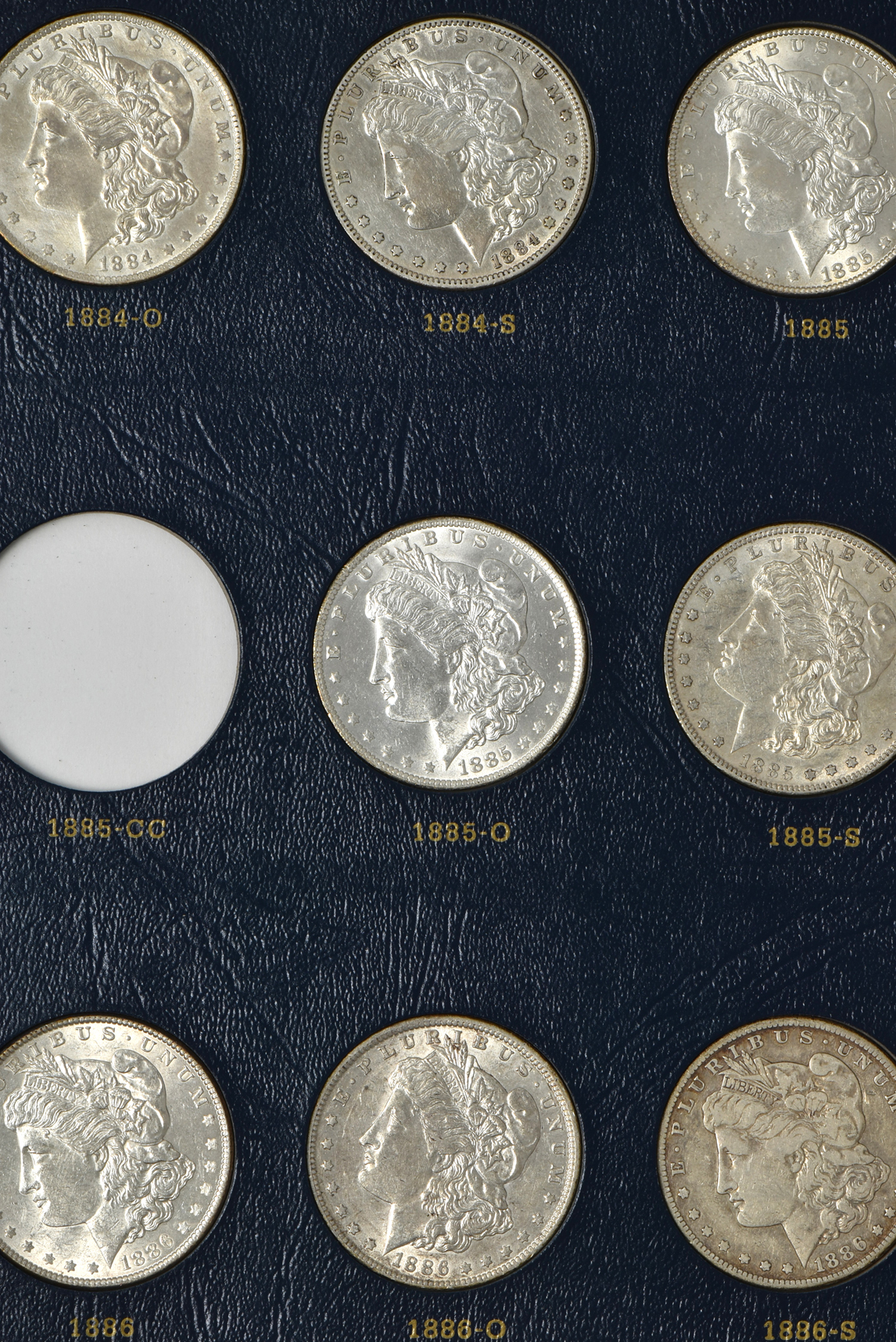 Collection of 46 different Morgan silver dollars in a Whitman 9128 album