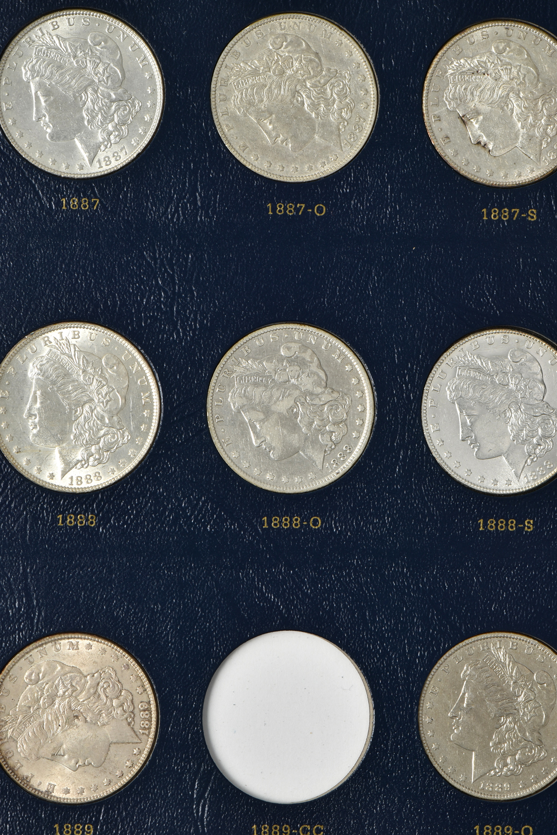 Collection of 46 different Morgan silver dollars in a Whitman 9128 album