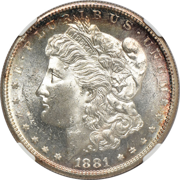 Four Morgan silver dollars.  Two PCGS MS-65, one NGC MS-65+, and one NGC MS-65