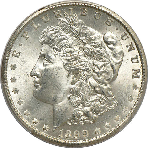 Four Morgan silver dollars.  Two PCGS MS-65, one NGC MS-65+, and one NGC MS-65