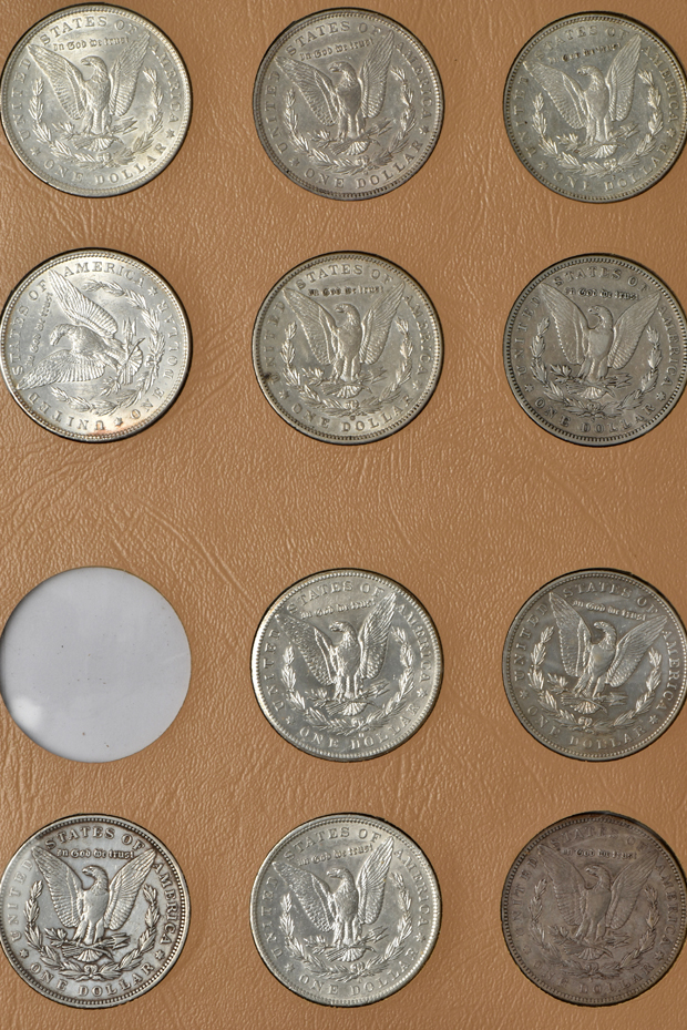 Collection of 44 different Morgan silver dollars in a Dansco album
