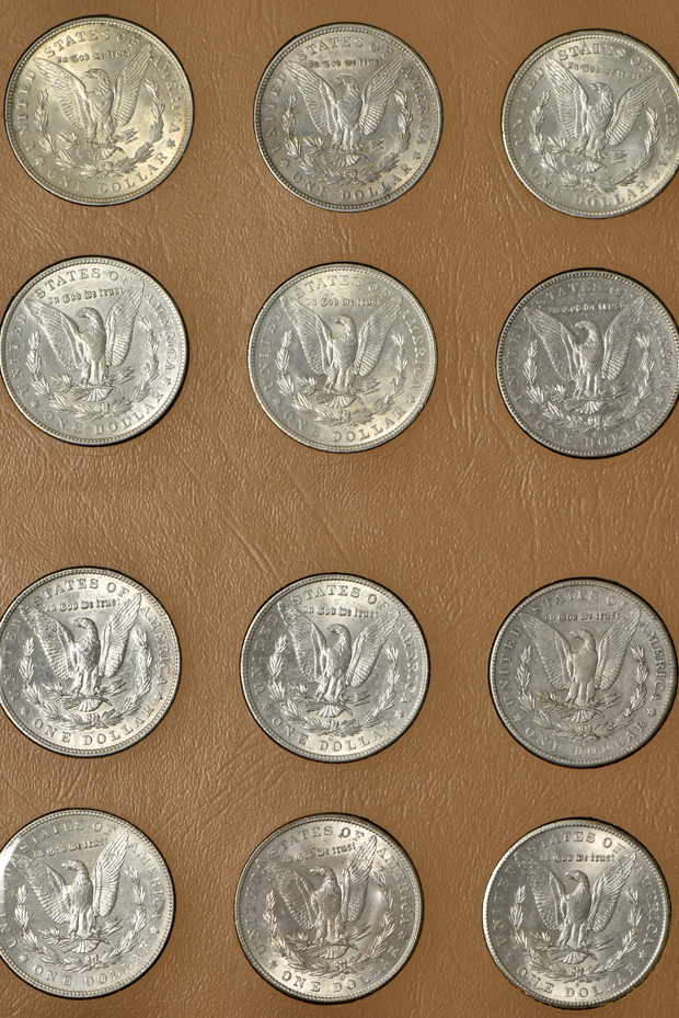 Collection of 44 different Morgan silver dollars in a Dansco album