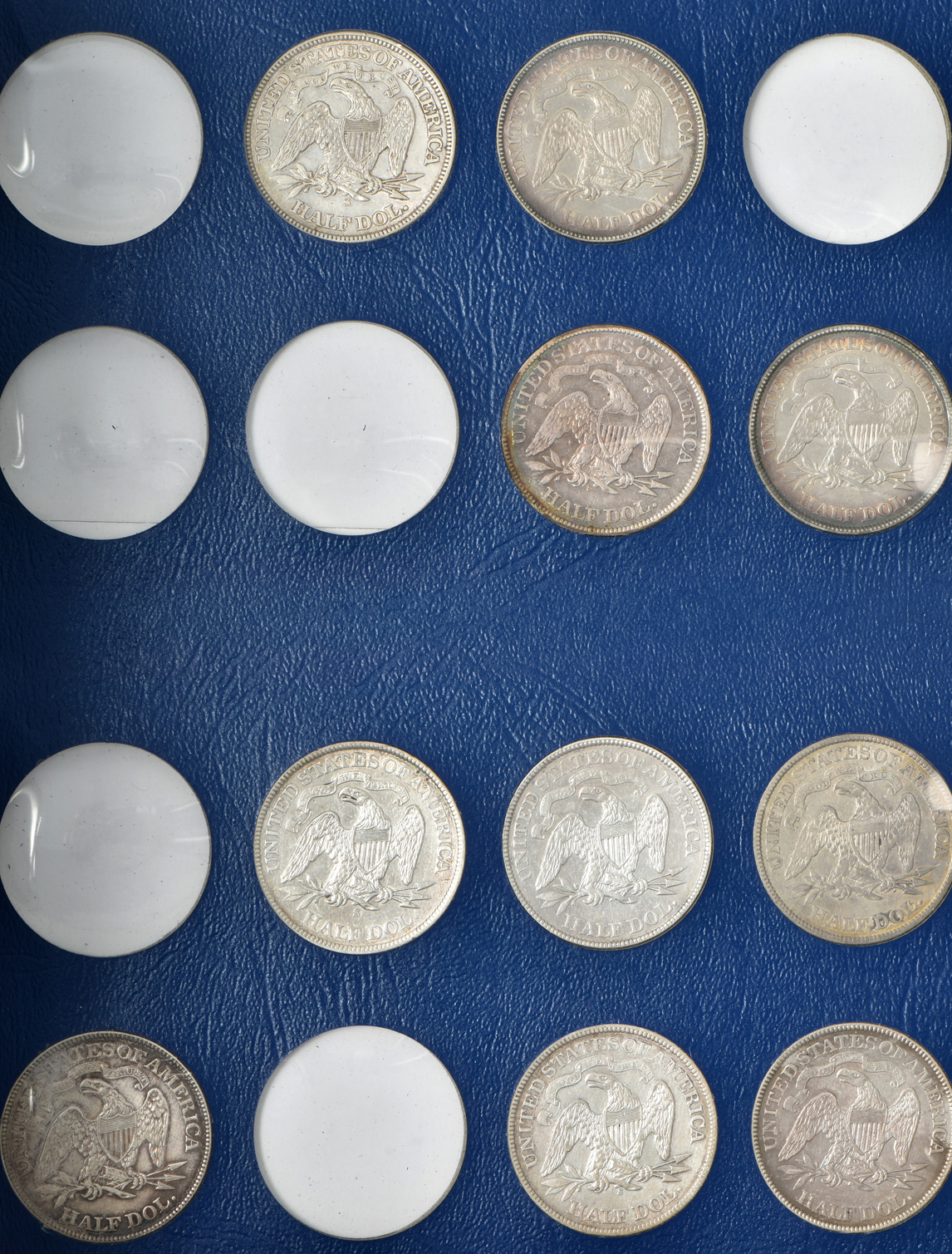 Collection of 33 different Liberty Seated half-dollars in a Whitman 9448 album