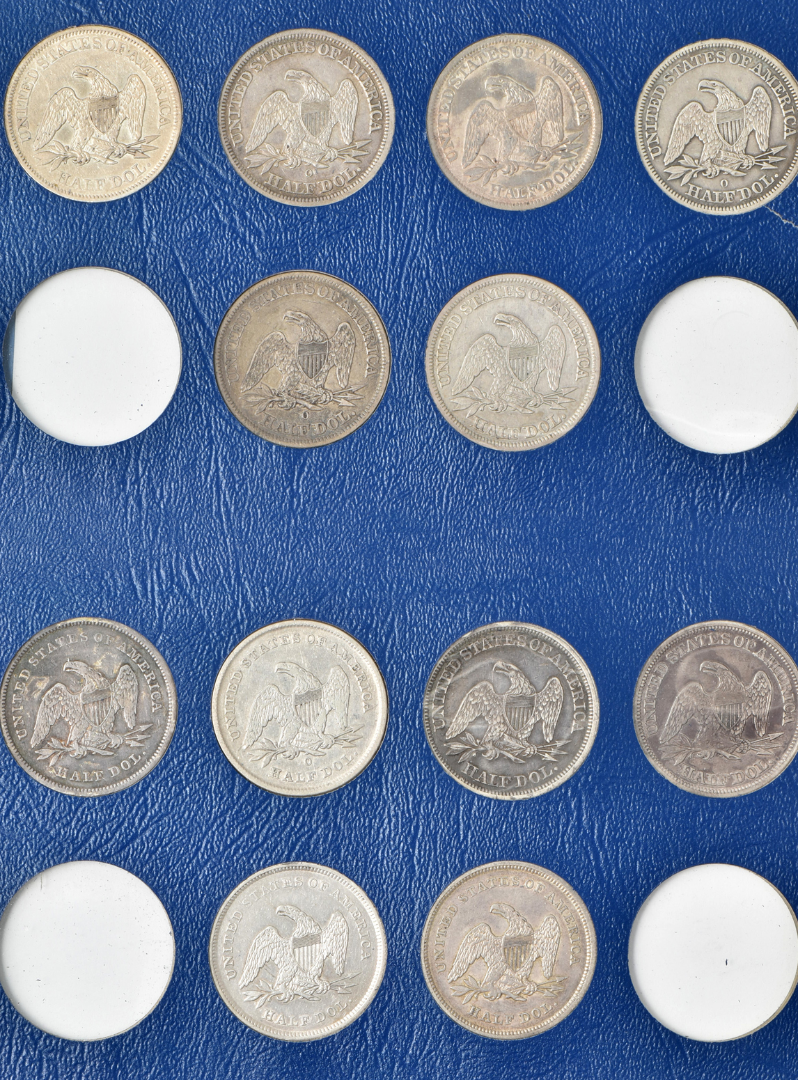Collection of 47 different Liberty Seated half-dollars in a Whitman 9447 album