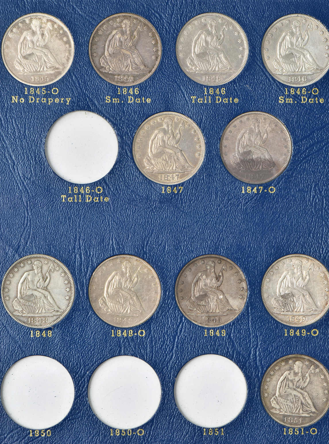 Collection of 47 different Liberty Seated half-dollars in a Whitman 9447 album
