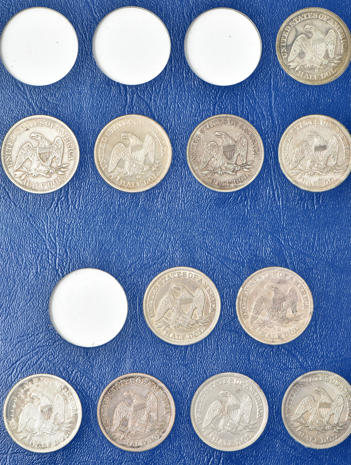 Collection of 47 different Liberty Seated half-dollars in a Whitman 9447 album