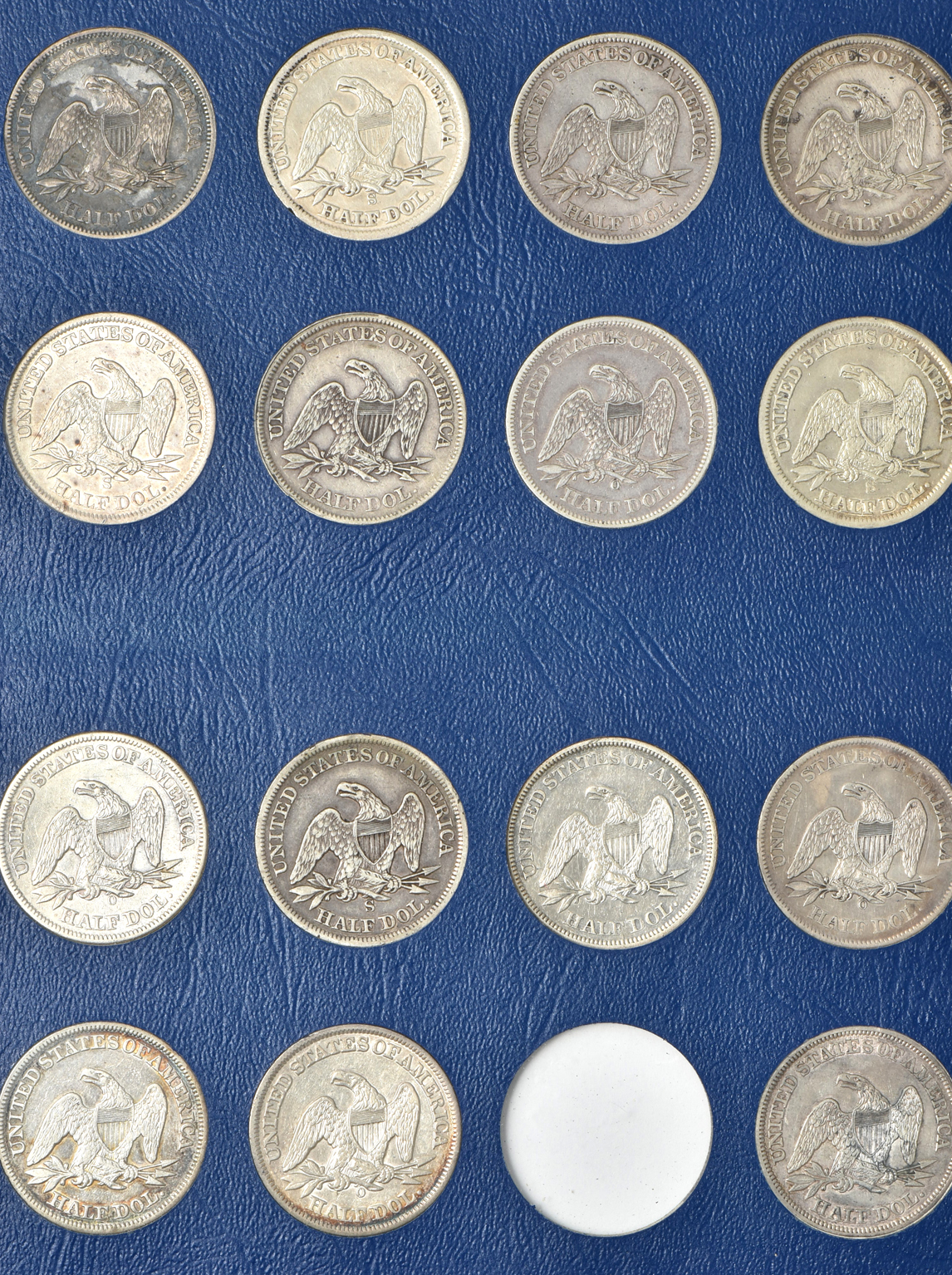 Collection of 47 different Liberty Seated half-dollars in a Whitman 9447 album