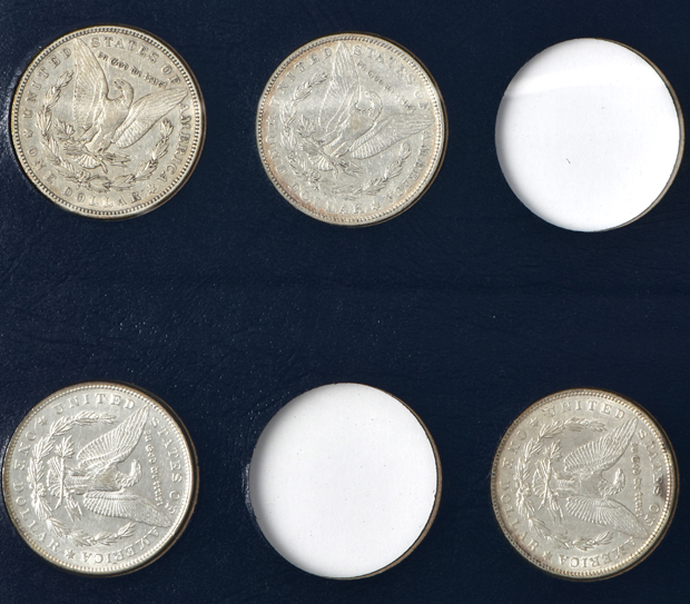 Collection of 34 different Morgan silver dollar in a Whitman Classic 9129 album