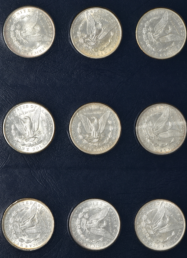 Collection of 34 different Morgan silver dollar in a Whitman Classic 9129 album