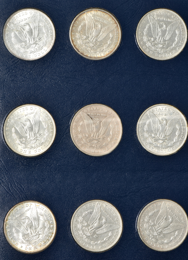 Collection of 34 different Morgan silver dollar in a Whitman Classic 9129 album