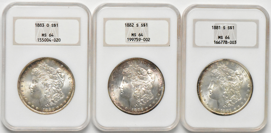 Seven Morgan silver dollars, all NGC MS-64 (no line)