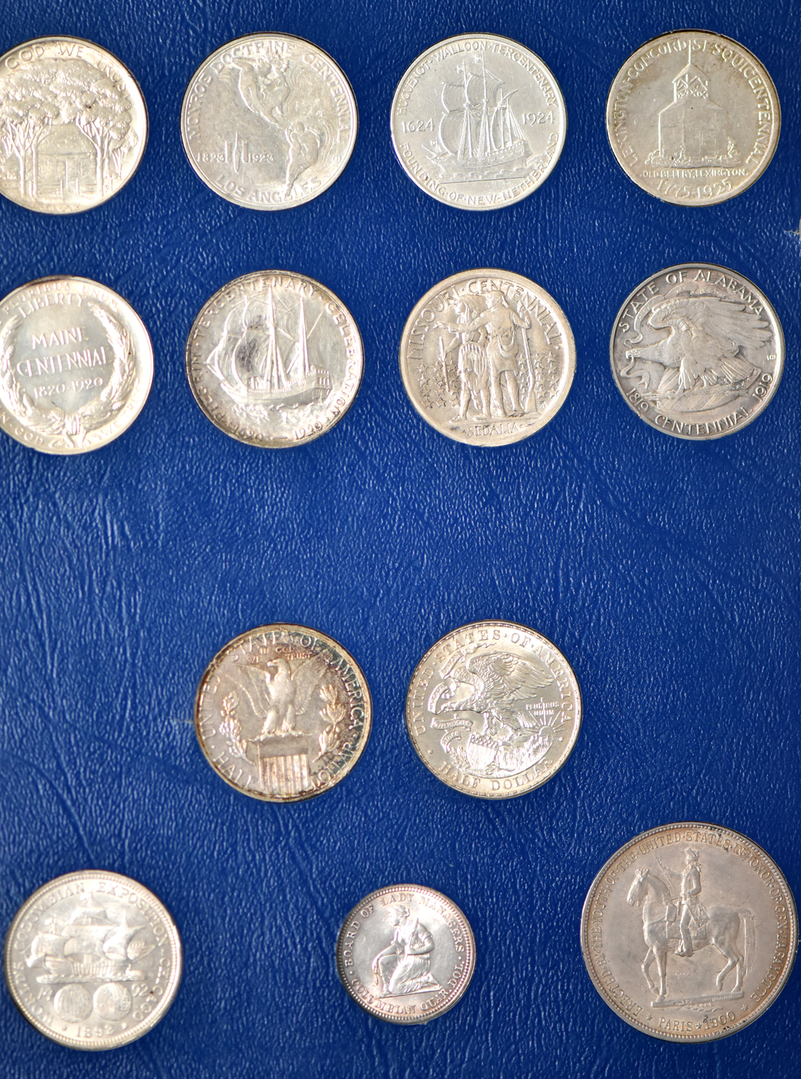 Collection of 48 different silver commemoratives in a nearly complete Whitman 9433 album