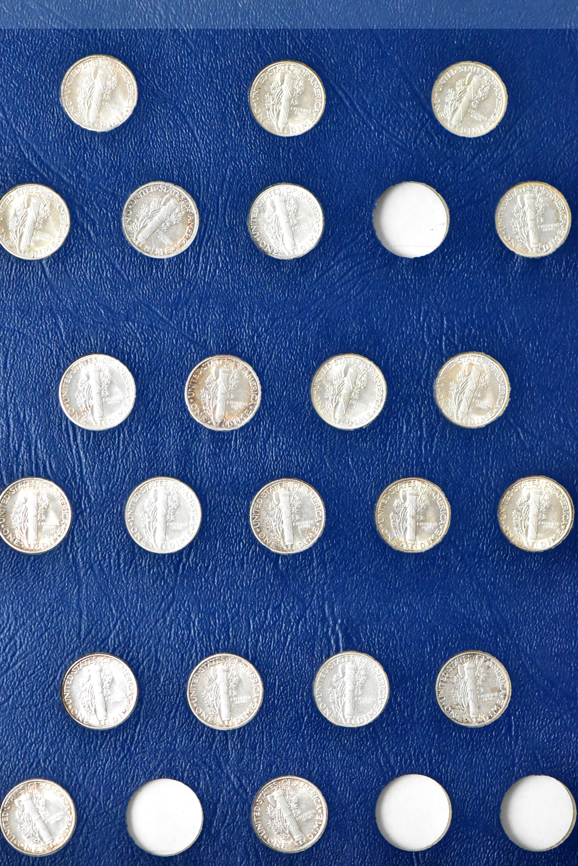 Collection of 55 different Mercury Dimes in a Whitman 9413 album