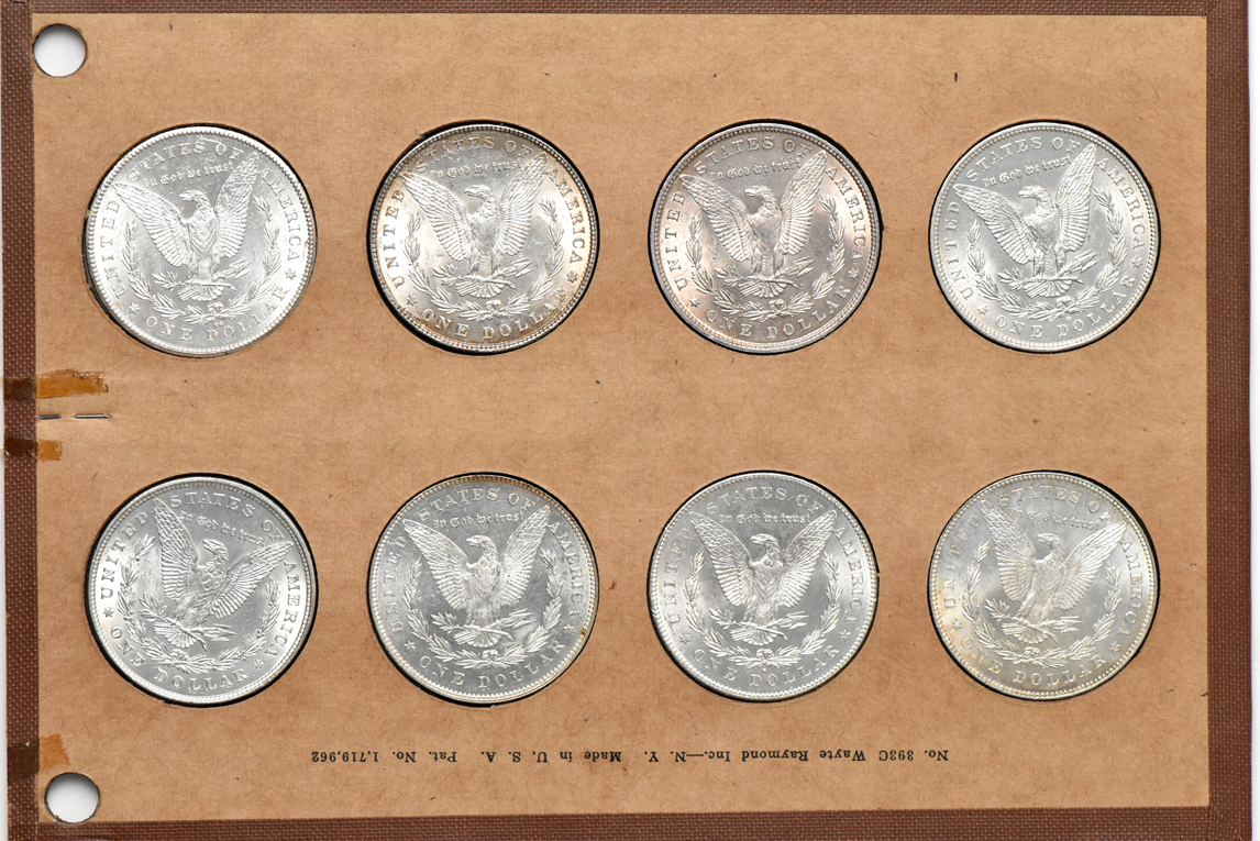 Collection of 32 different Morgan silver dollars in a Wayte Raymond album