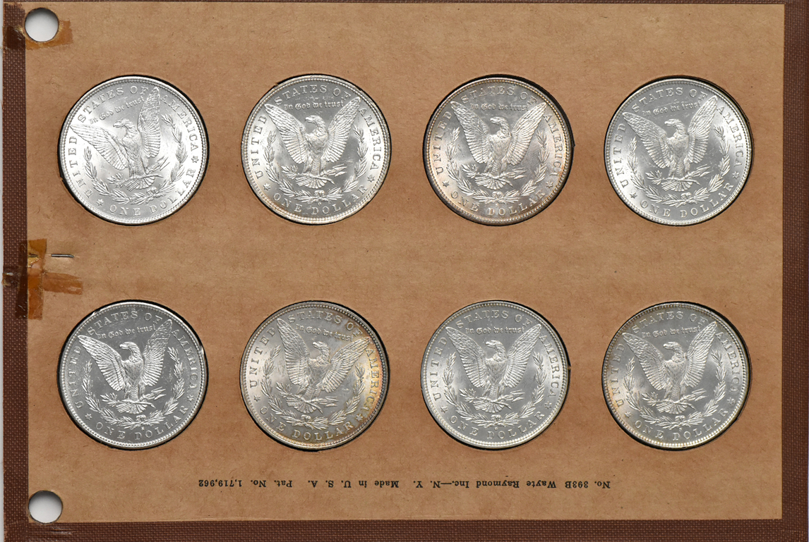 Collection of 32 different Morgan silver dollars in a Wayte Raymond album