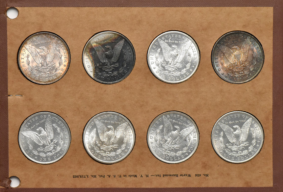 Collection of 32 different Morgan silver dollars in a Wayte Raymond album