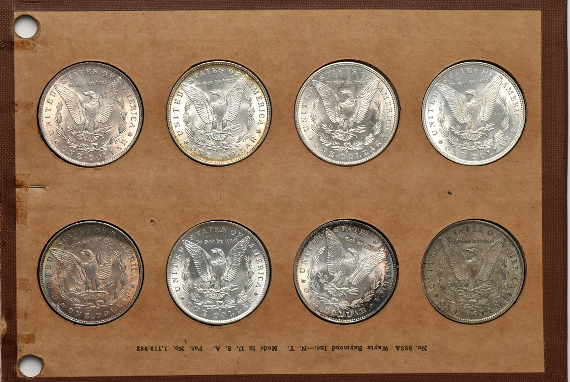 Collection of 32 different Morgan silver dollars in a Wayte Raymond album