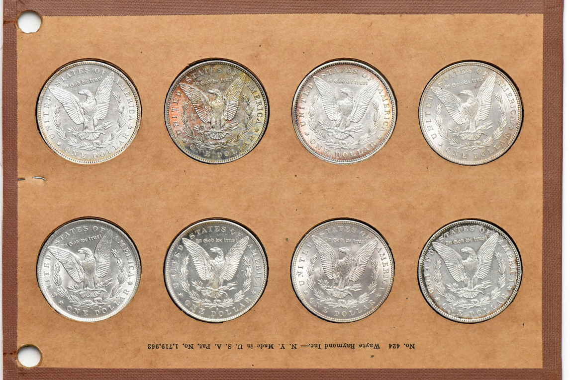 Collection of 32 different Morgan silver dollars in a Wayte Raymond album