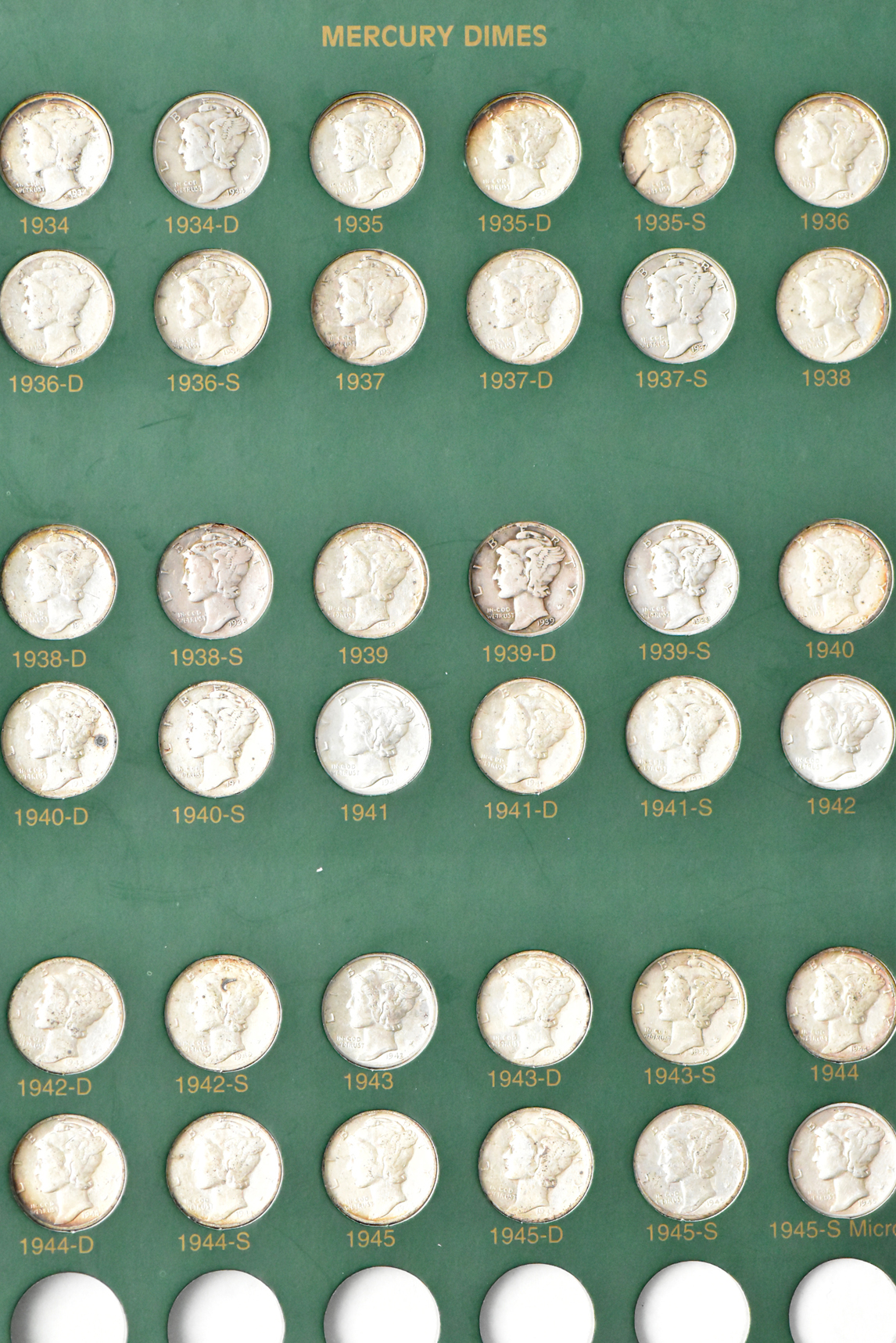 Complete collection of Mercury dimes in an album