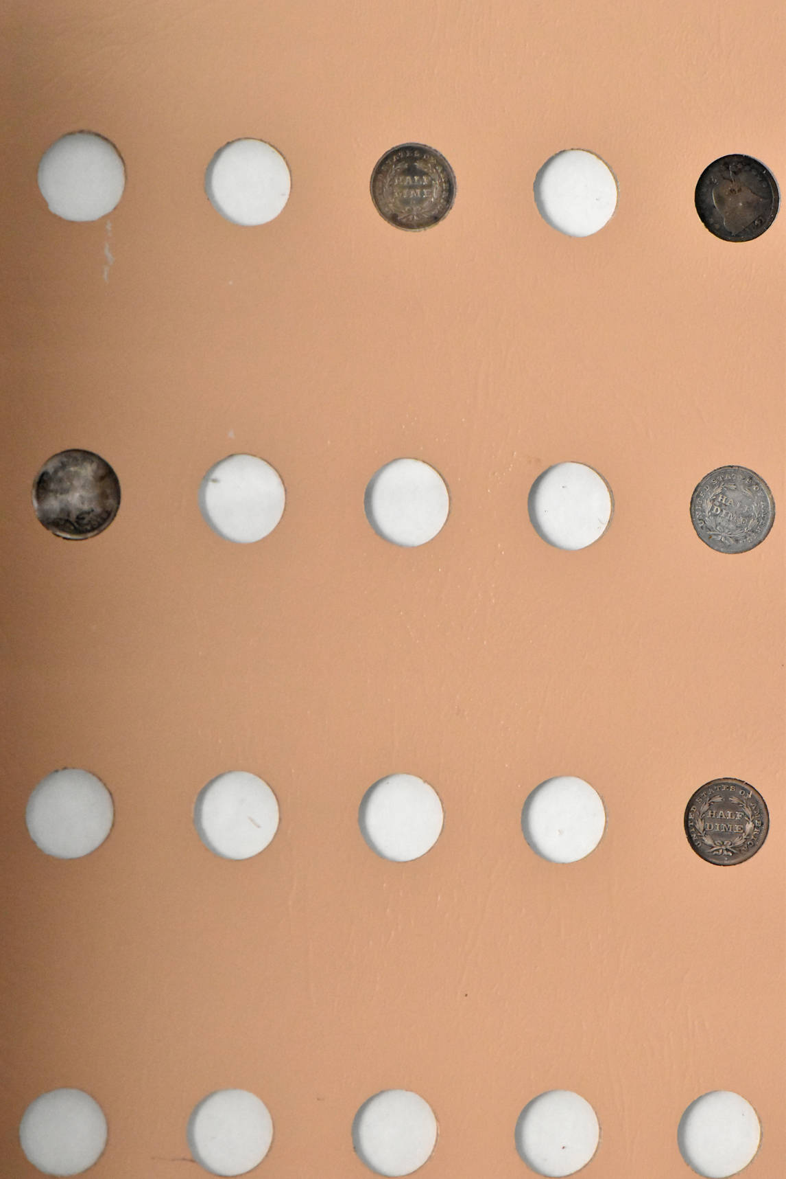 Group of 34 different half-dimes in a Dansco 6120 album