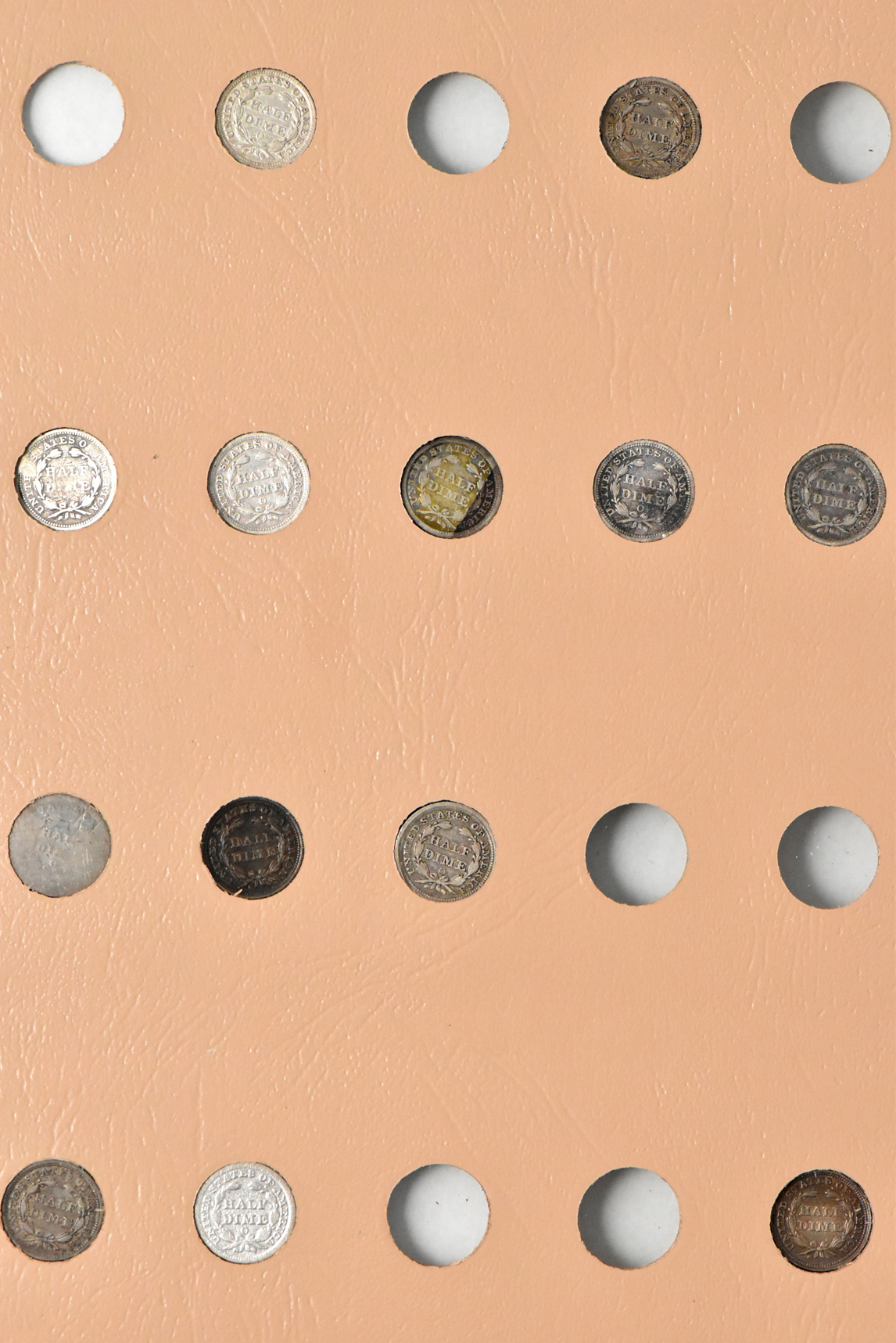 Group of 34 different half-dimes in a Dansco 6120 album