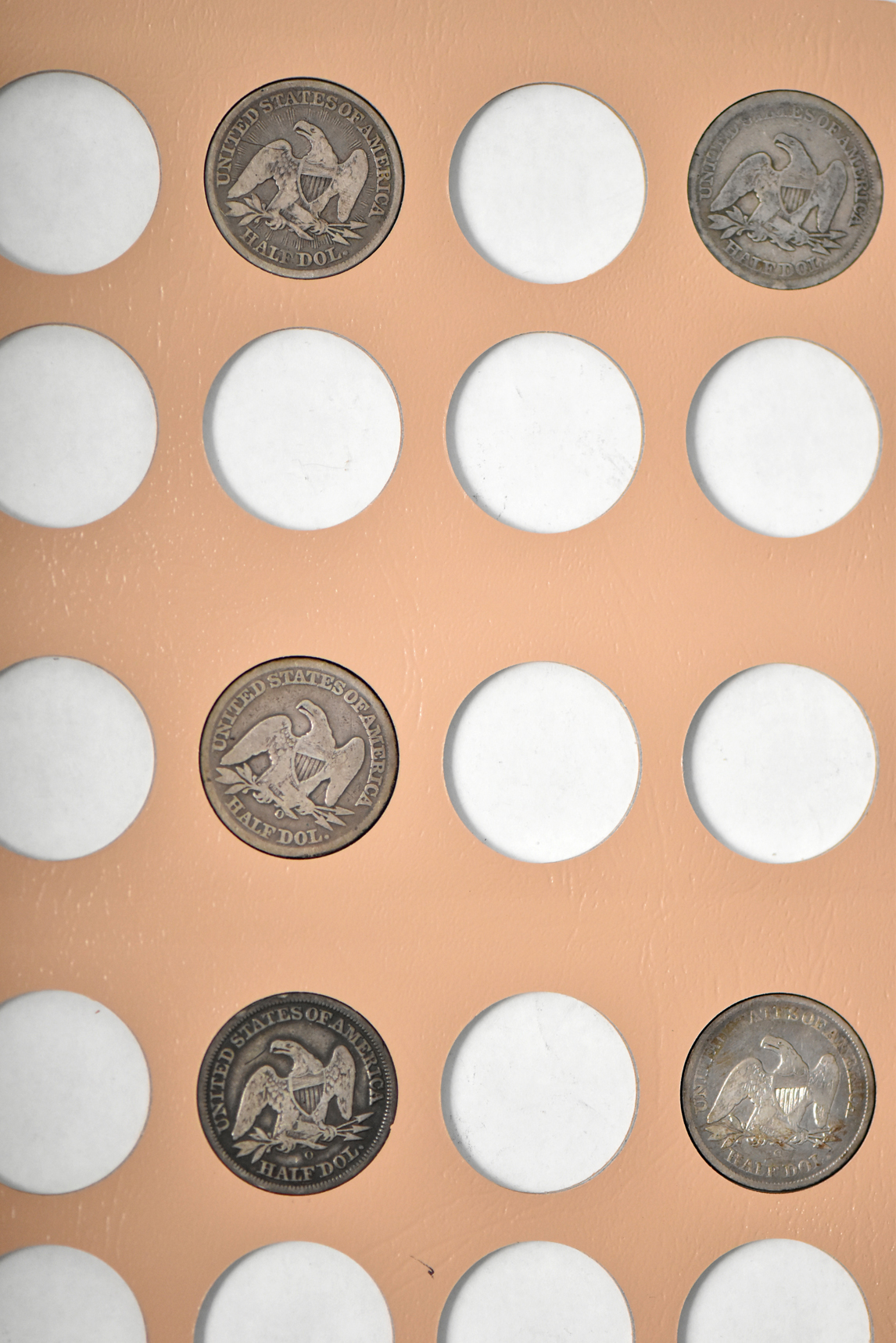 Collection of 32 different Liberty Seated half-dollars in a Dansco 6152 album