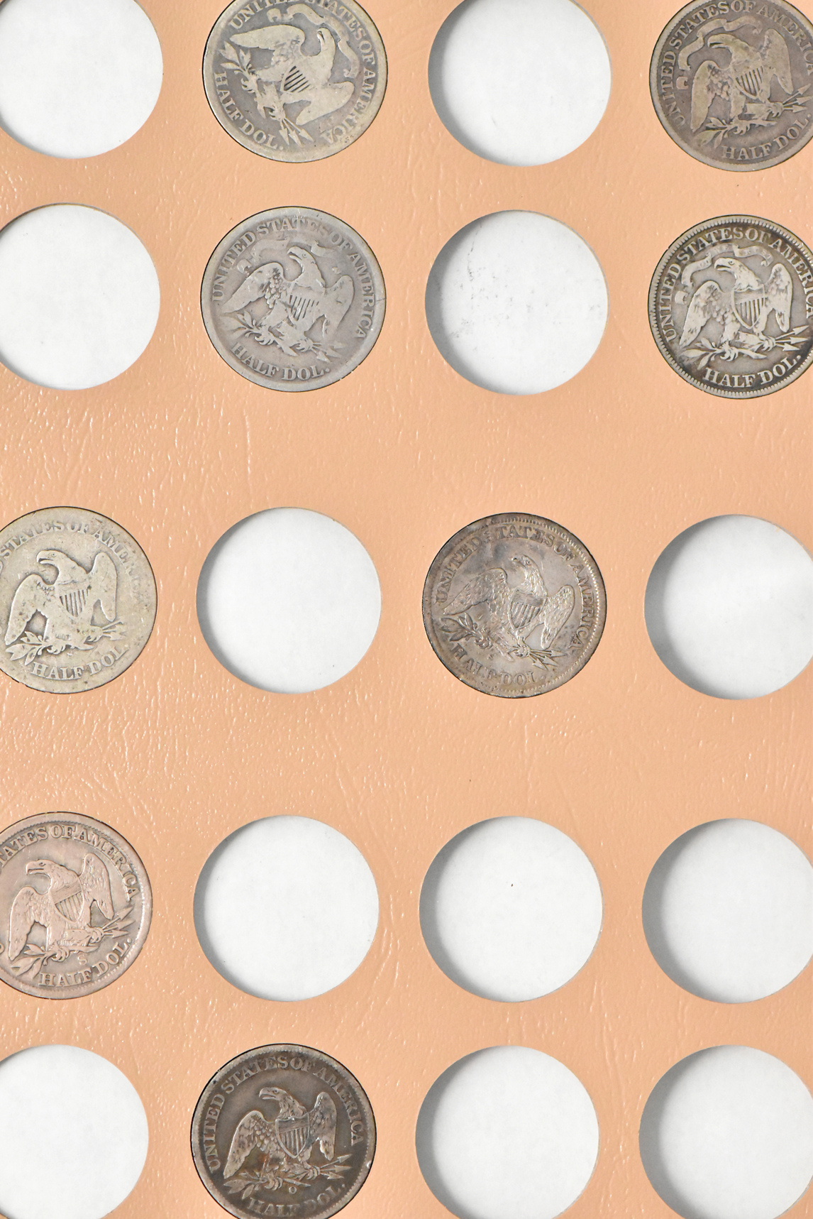 Collection of 32 different Liberty Seated half-dollars in a Dansco 6152 album