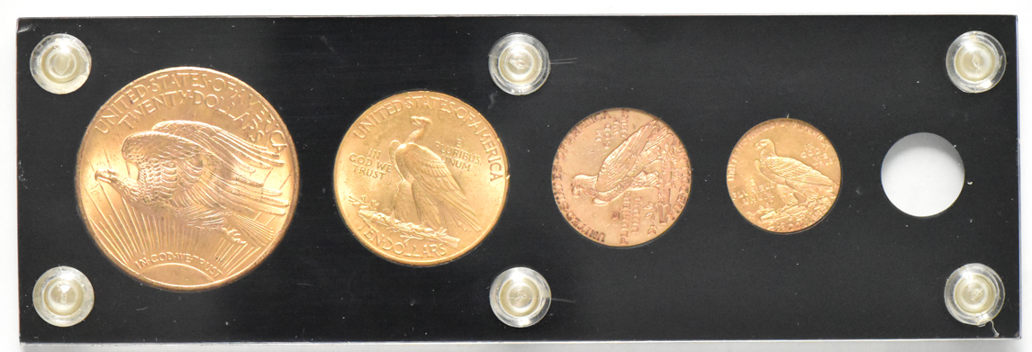 Four gold coins in a Capital Plastics holder